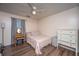 This bedroom features wood floors, a ceiling fan, and lots of natural light at 160 Lancashire Rd, Summerville, SC 29486