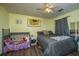 Inviting bedroom with sunflower art, ceiling fan, closet, and a combination bed and toddler-bed setup at 160 Lancashire Rd, Summerville, SC 29486