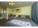 Charming bedroom with sunflower art, ceiling fan, closet, and spacious sleeping arrangement at 160 Lancashire Rd, Summerville, SC 29486