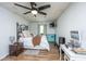 This bedroom has wood floors, a black ceiling fan, and lots of natural light at 160 Lancashire Rd, Summerville, SC 29486