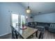 Inviting dining area with modern table set and chair, adjacent to living room with ample natural light at 160 Lancashire Rd, Summerville, SC 29486