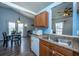 Bright kitchen with stainless steel sink, wood cabinets, updated appliances and eat-in dining area at 160 Lancashire Rd, Summerville, SC 29486