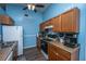 Well-lit kitchen showcases wood cabinets, speckled countertops, modern appliances, and stylish flooring at 160 Lancashire Rd, Summerville, SC 29486