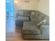 Comfortable living room with a large sectional sofa and ottoman on hardwood floors at 160 Lancashire Rd, Summerville, SC 29486