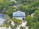 Aerial view of a home nestled amongst lush greenery at 1604 Jungle Rd, Edisto Island, SC 29438