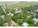 Breathtaking aerial view of the neighborhood with lush greenery and serene marsh views at 1604 Jungle Rd, Edisto Island, SC 29438