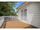 Enjoy outdoor living on this private balcony with white railings and a sliding glass door for seamless indoor-outdoor flow at 1604 Jungle Rd, Edisto Island, SC 29438