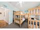 Bedroom featuring wooden bunk beds, ceiling fan, and an organized closet at 1604 Jungle Rd, Edisto Island, SC 29438