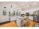 Well-lit kitchen features stainless appliances, granite countertops, and ample cabinet space at 1604 Jungle Rd, Edisto Island, SC 29438