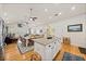 Kitchen boasts stainless appliances, an island with seating, and seamless flow to the dining area at 1604 Jungle Rd, Edisto Island, SC 29438