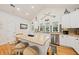 Bright kitchen features stainless appliances, granite counters, and island with seating at 1604 Jungle Rd, Edisto Island, SC 29438