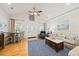 Bright living room features hardwood floors, comfortable seating, and abundant natural light at 1604 Jungle Rd, Edisto Island, SC 29438