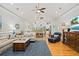 Spacious living room with hardwood floors, vaulted ceilings, and an open layout to the dining area at 1604 Jungle Rd, Edisto Island, SC 29438