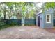 Large backyard with a fence and additional storage shed with red door at 183 Ionsborough St, Mount Pleasant, SC 29464