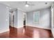 Spacious bedroom with hardwood floors, ceiling fan, and trim at 183 Ionsborough St, Mount Pleasant, SC 29464