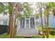Charming home with a welcoming front porch, white railings, and lush landscaping at 183 Ionsborough St, Mount Pleasant, SC 29464