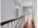 Light-filled hallway with hardwood floors and trim at 183 Ionsborough St, Mount Pleasant, SC 29464