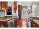 Gourmet kitchen with stainless steel appliances, granite counters, and rich wood cabinetry at 183 Ionsborough St, Mount Pleasant, SC 29464