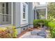 Serene side yard with a fountain, greenery, and outdoor seating for relaxation at 183 Ionsborough St, Mount Pleasant, SC 29464