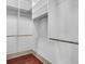 Walk-in closet with adjustable shelving and wood floors at 183 Ionsborough St, Mount Pleasant, SC 29464