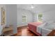 Bright bedroom features hardwood floors, neutral walls, and large windows at 1940 Orangeburg St, North Charleston, SC 29405