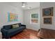 Cozy bedroom features hardwood floors, a sofa, and a large map of the United States at 1940 Orangeburg St, North Charleston, SC 29405