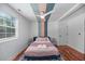 Bright bedroom with a ceiling fan, natural light, and minimalist design elements at 1940 Orangeburg St, North Charleston, SC 29405