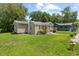 Charming home featuring well-maintained landscaping and a welcoming front porch at 1940 Orangeburg St, North Charleston, SC 29405