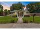 Charming single-story home features a well-manicured lawn and inviting front porch with a mailbox on the side at 1940 Orangeburg St, North Charleston, SC 29405