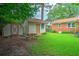 Spacious backyard featuring two storage sheds and a picnic table, providing ample outdoor storage and recreation space at 1967 Campion Hall Rd, Charleston, SC 29407