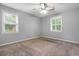 Bedroom featuring neutral walls and carpet, with two windows allowing natural light to fill the space at 1967 Campion Hall Rd, Charleston, SC 29407