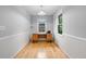 Small office space with hardwood floors, wainscotting, and a built in desk at 1967 Campion Hall Rd, Charleston, SC 29407