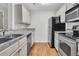 Open kitchen area with modern appliances, granite countertops and hardwood-style floors at 2011 N Hwy 17 # 2200H, Mount Pleasant, SC 29466