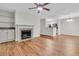 Spacious living room with a fireplace, wood flooring, and an open layout connecting to the kitchen at 2011 N Hwy 17 # 2200H, Mount Pleasant, SC 29466