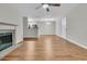Bright living area features a fireplace, hardwood floors, and an open layout to dining area at 2011 N Hwy 17 # 2200H, Mount Pleasant, SC 29466