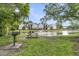 Community picnic area next to a pond and apartment buildings at 2011 N Hwy 17 # 2200H, Mount Pleasant, SC 29466