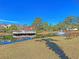 Picturesque pond view with fountain, surrounded by green grass and mature trees at 2011 N Hwy 17 # 2200H, Mount Pleasant, SC 29466