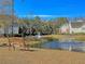 Community pond with mature trees, fountain and bench seating at 2011 N Hwy 17 # 2200H, Mount Pleasant, SC 29466
