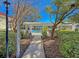 Pathway to a refreshing community pool with pergola, surrounded by lush landscaping and blue sky at 2011 N Hwy 17 # 2200H, Mount Pleasant, SC 29466