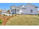 Expansive backyard featuring a screened porch, white siding, and a detached garage at 2038 Sea Water Dr, James Island, SC 29412