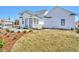 Expansive backyard featuring a screened porch, white siding, and a detached garage at 2038 Sea Water Dr, James Island, SC 29412
