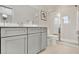 This bathroom features gray cabinets, silver hardware, and a walk-in shower with glass doors at 2038 Sea Water Dr, James Island, SC 29412