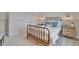 This bedroom features neutral walls and a decorative iron bed frame, offering a serene atmosphere at 2038 Sea Water Dr, James Island, SC 29412