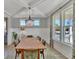 Elegant dining room featuring large windows, decorative chandelier, and seating for eight at 2038 Sea Water Dr, James Island, SC 29412