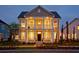 Charming two-story home with a double porch, manicured lawn, and inviting curb appeal at dusk at 2038 Sea Water Dr, James Island, SC 29412