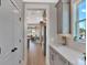 Bright kitchen hallway with stainless steel appliances and gray cabinets at 2038 Sea Water Dr, James Island, SC 29412