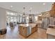 Kitchen and living room view featuring a large island with seating, stainless steel appliances at 2038 Sea Water Dr, James Island, SC 29412