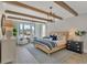 Serene main bedroom with wood beam ceiling, stylish furniture, and ample natural light at 2038 Sea Water Dr, James Island, SC 29412