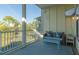 Relaxing outdoor balcony featuring comfortable seating and picturesque views of the surrounding area at 204 Michigan Ave # C-5 - 11, Folly Beach, SC 29439