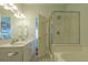 Modern bathroom features a double vanity, glass shower, and soaking tub at 204 Michigan Ave # C-5 - 11, Folly Beach, SC 29439